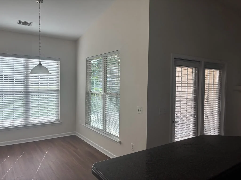 Recently refreshed open living and dining area with wood flooring