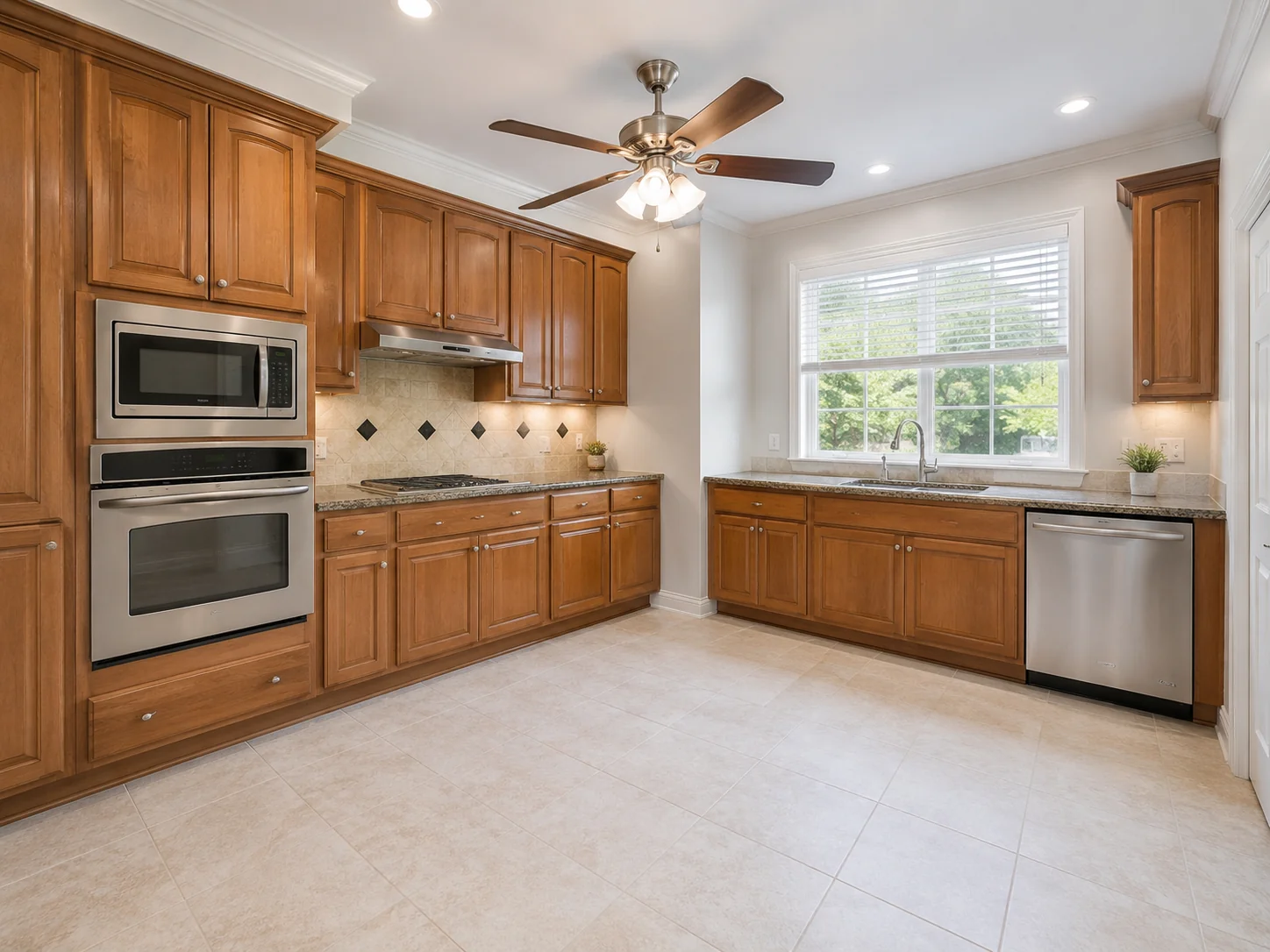 Finished kitchen with warm wood cabinetry and stainless appliances